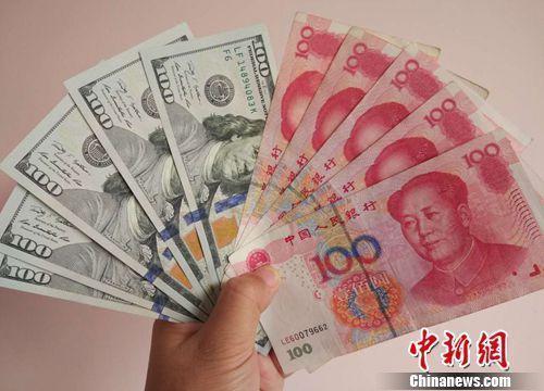 資料圖：人民幣和美元。<a target='_blank'  _fcksavedurl='http://www.chinanews.com/' ></table>中新網(wǎng)</a>記者 李金磊 攝